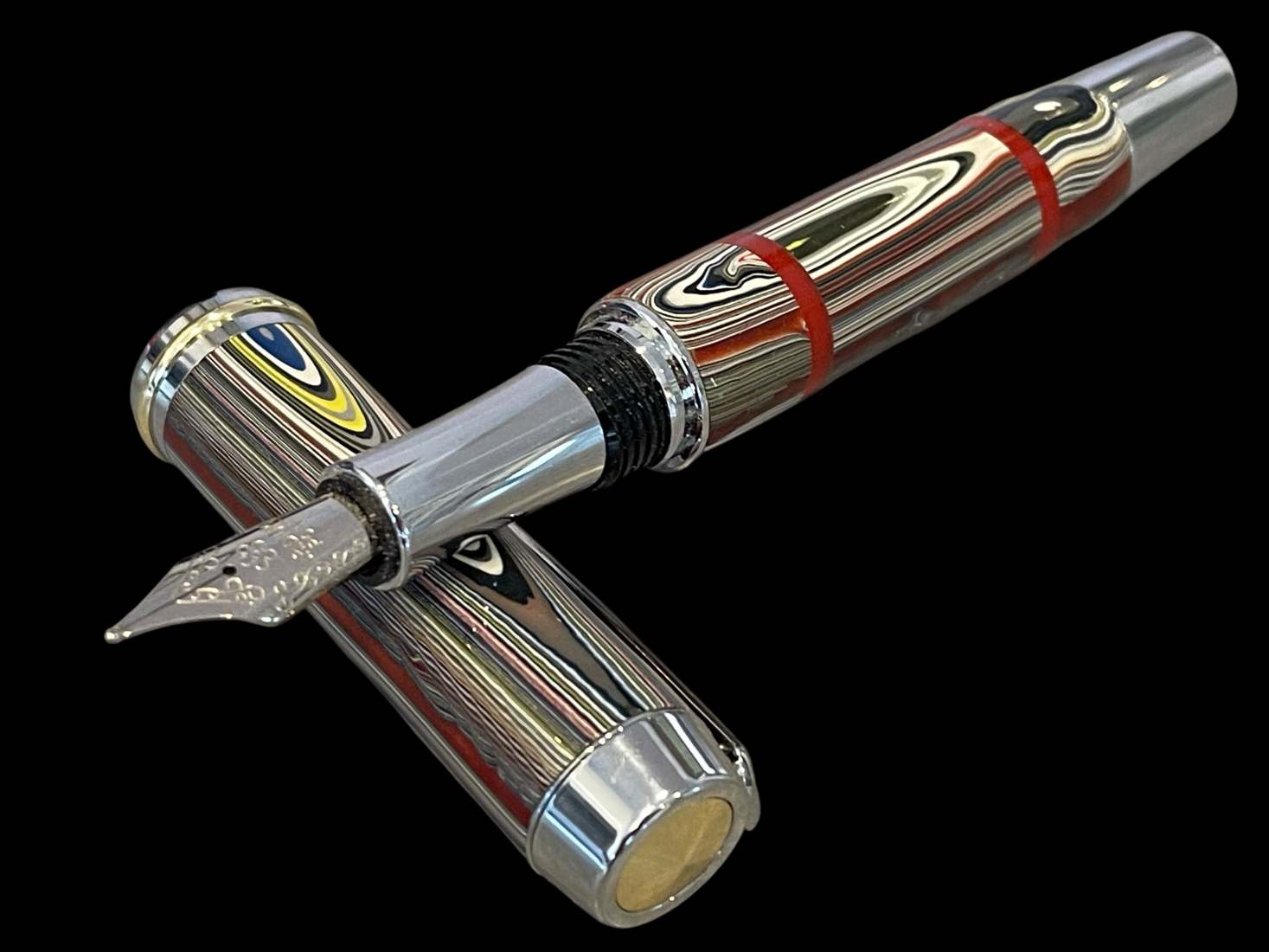 Fordite Fountain Pen with Red Acrylic Accents - Image 4