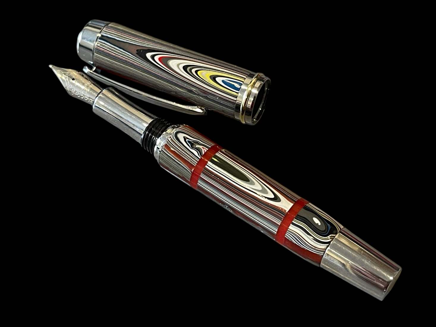Fordite Fountain Pen with Red Acrylic Accents - Image 2
